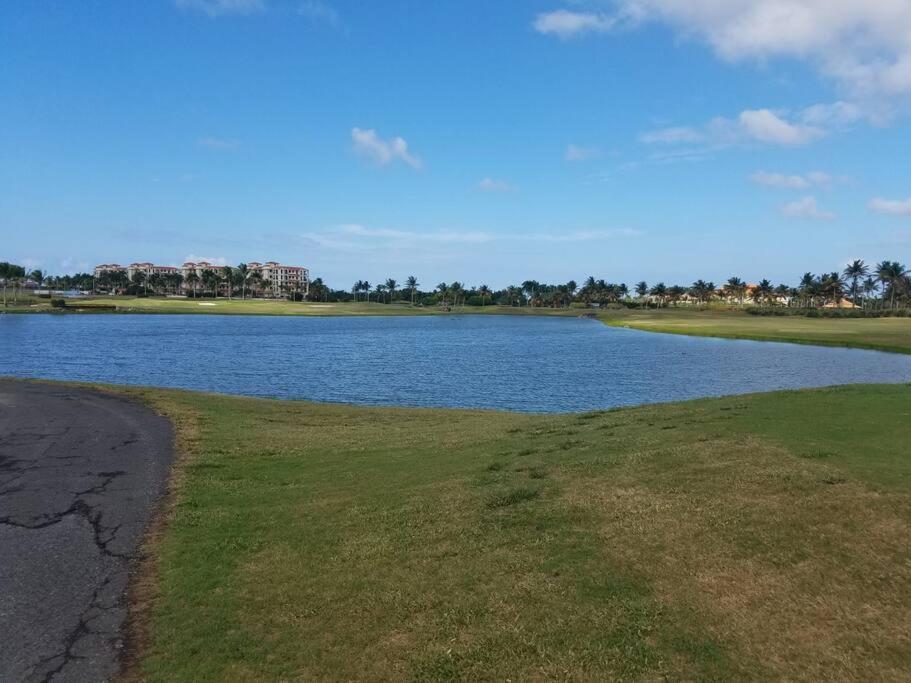 a large body of water with a grassy field next to it at Cozy suite at coco Beach , not pets in Rio Grande