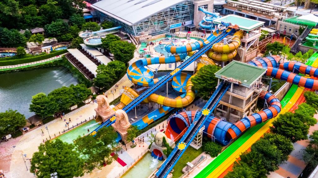 an aerial view of a water park with a roller coaster at VivaldiPark in Hongcheon