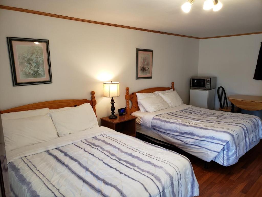 Postel nebo postele na pokoji v ubytování Scoodic Motel