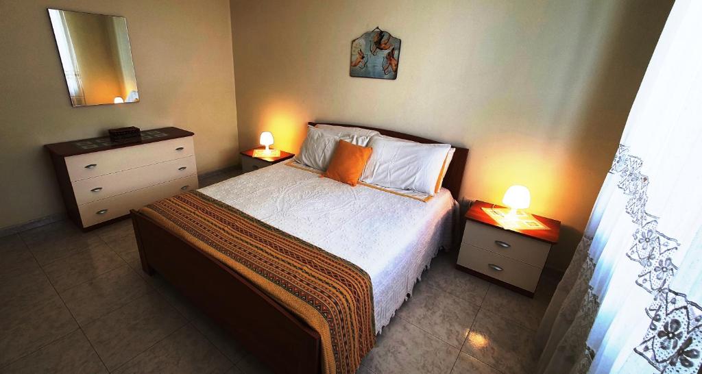 Postel nebo postele na pokoji v ubytování Via Ugento Apartments - a pochi passi dalle spiagge