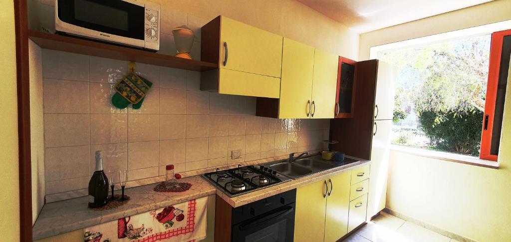 Kuchyň nebo kuchyňský kout v ubytování Via Ugento Apartments - a pochi passi dalle spiagge