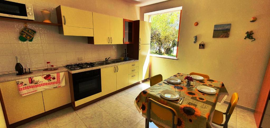 Kuchyň nebo kuchyňský kout v ubytování Via Ugento Apartments - a pochi passi dalle spiagge