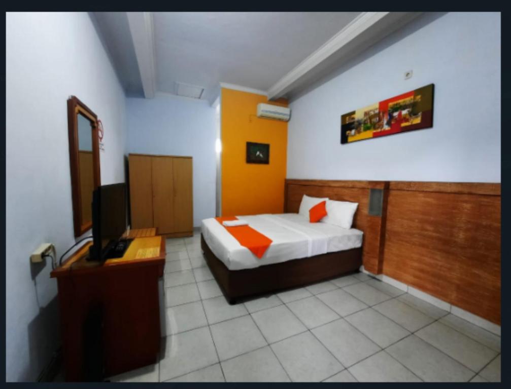 Postel nebo postele na pokoji v ubytování deSERUNI Guest House Kerobokan