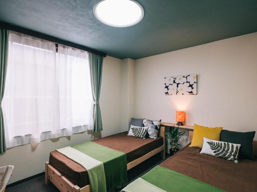 Кровать или кровати в номере Noasobi Lodge 203- Vacation STAY 23343v