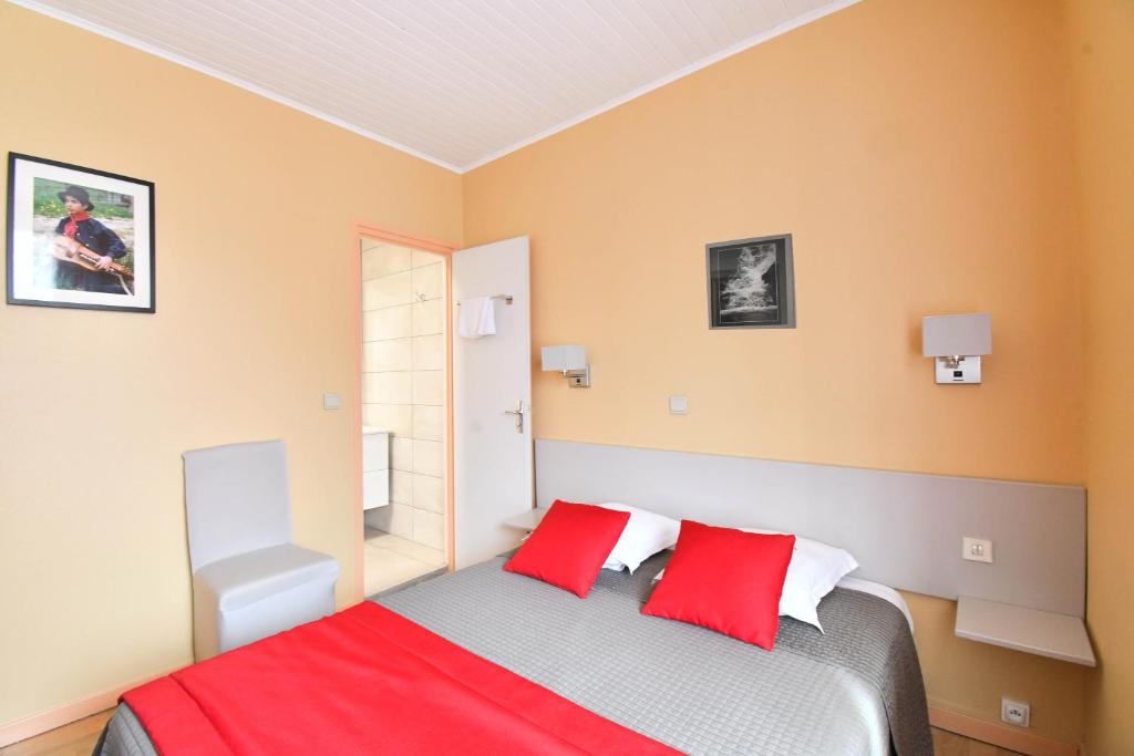 Postel nebo postele na pokoji v ubytování Hotel Fortin