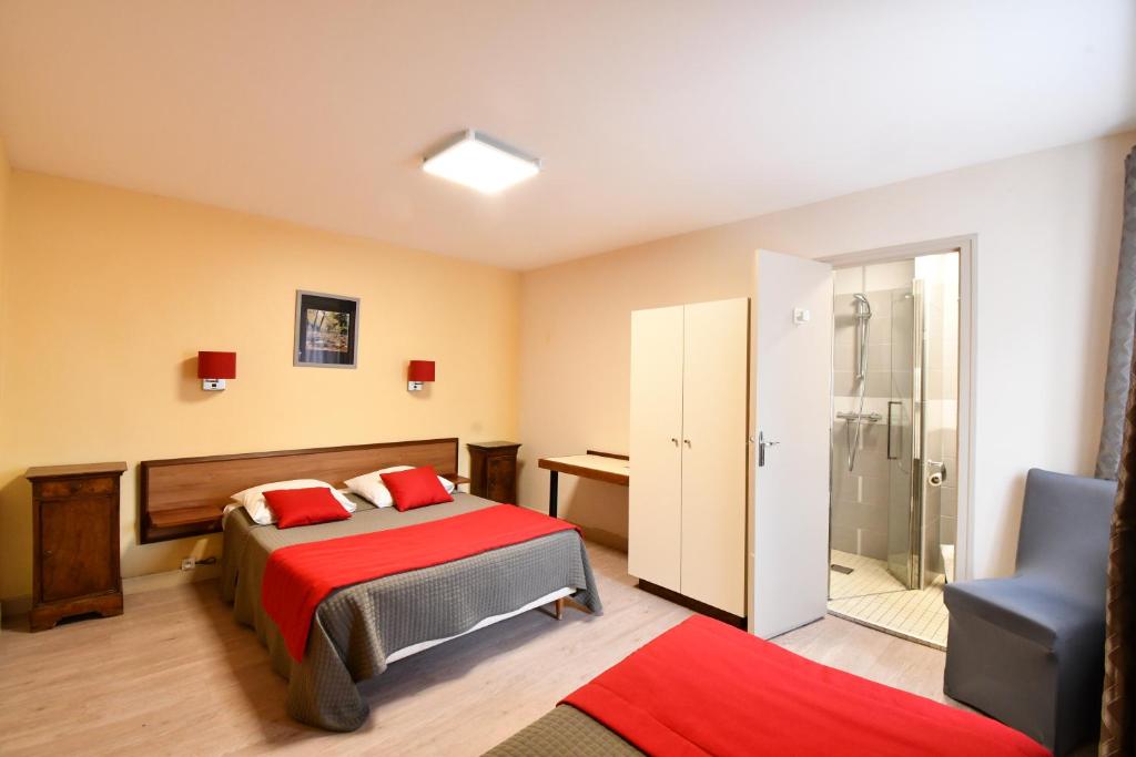Postel nebo postele na pokoji v ubytování Hotel Fortin
