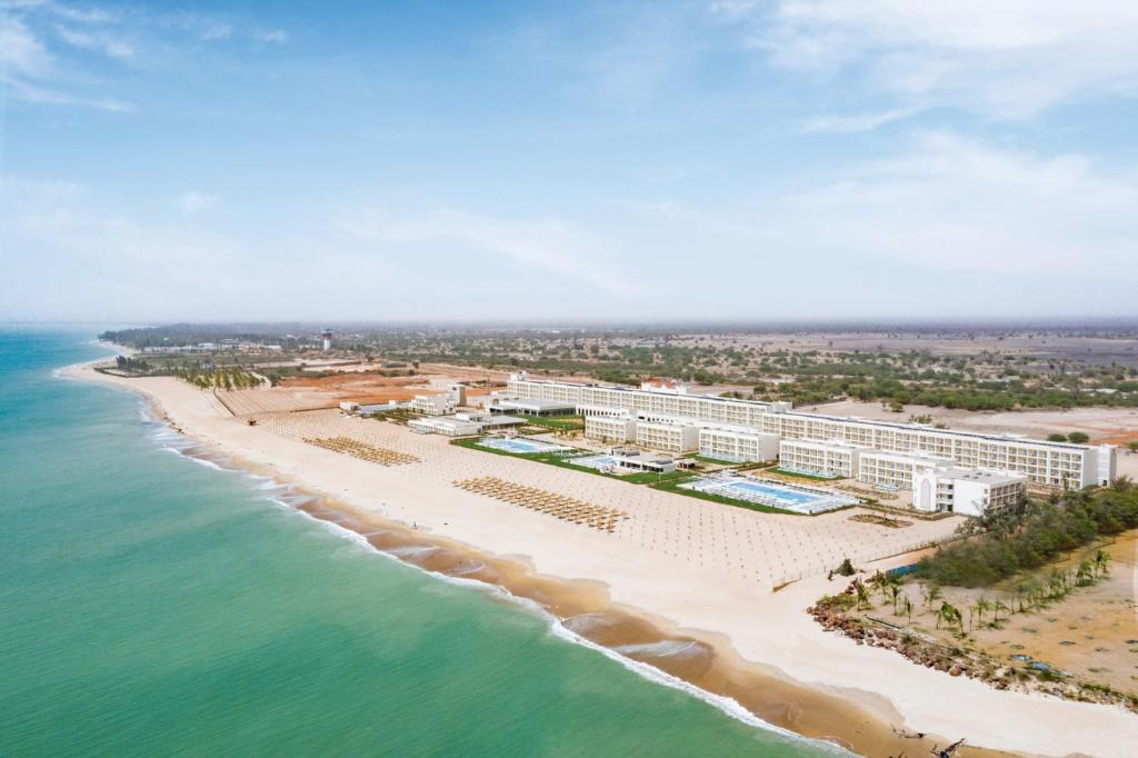 an aerial view of the resort and the beach at Hotel Riu Baobab - All Inclusive in Pointe-Sarène