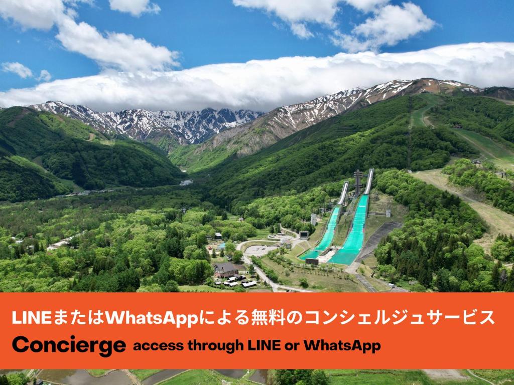 an aerial view of a valley with mountains at Phoenix Chalets by HHG in Hakuba
