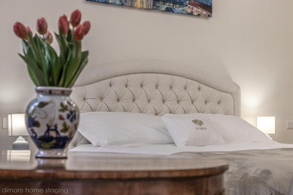 Łóżko lub łóżka w pokoju w obiekcie Casa Maghinardo