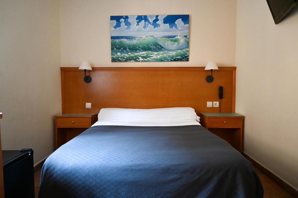 Posteľ alebo postele v izbe v ubytovaní Hotel Doña Catalina