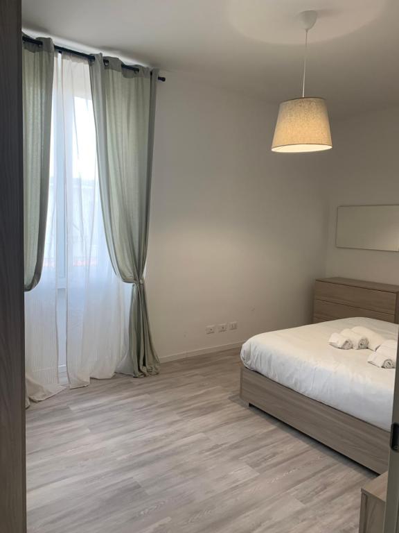 Postel nebo postele na pokoji v ubytování CASA 8 GIUGNO