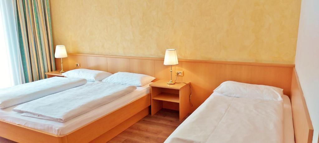 Postel nebo postele na pokoji v ubytování Hotel Brenner - Stop & Go