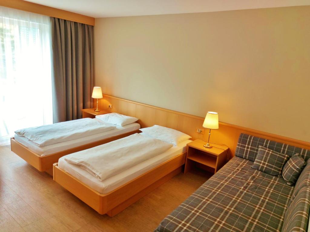 Postel nebo postele na pokoji v ubytování Hotel Brenner - Stop & Go