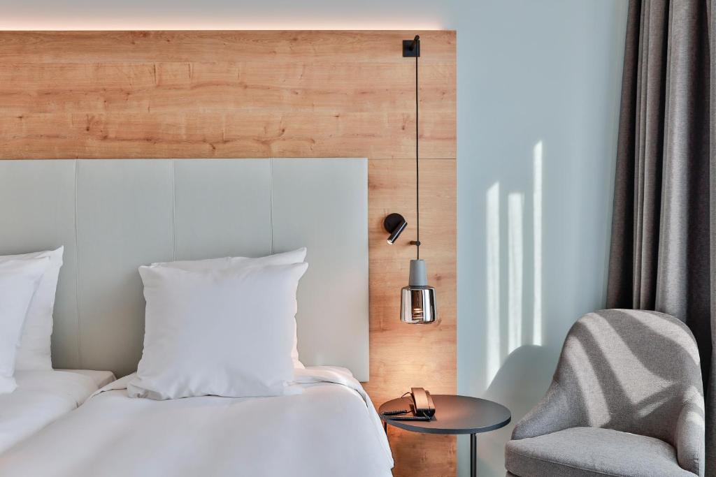 Postel nebo postele na pokoji v ubytování Radisson Hotel Liege City Centre