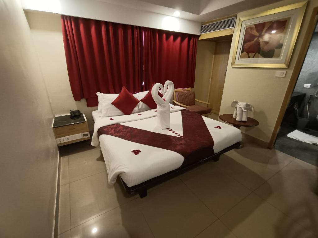 Postel nebo postele na pokoji v ubytování Savera Hotel