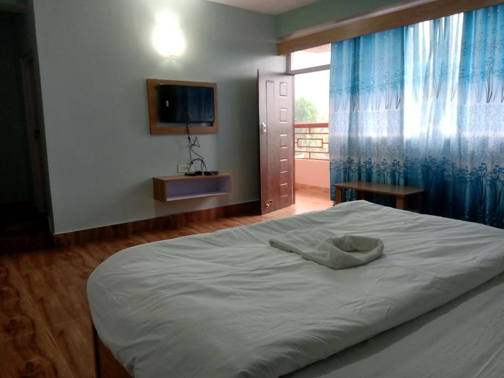 Letto o letti in una camera di Mandavya homestay