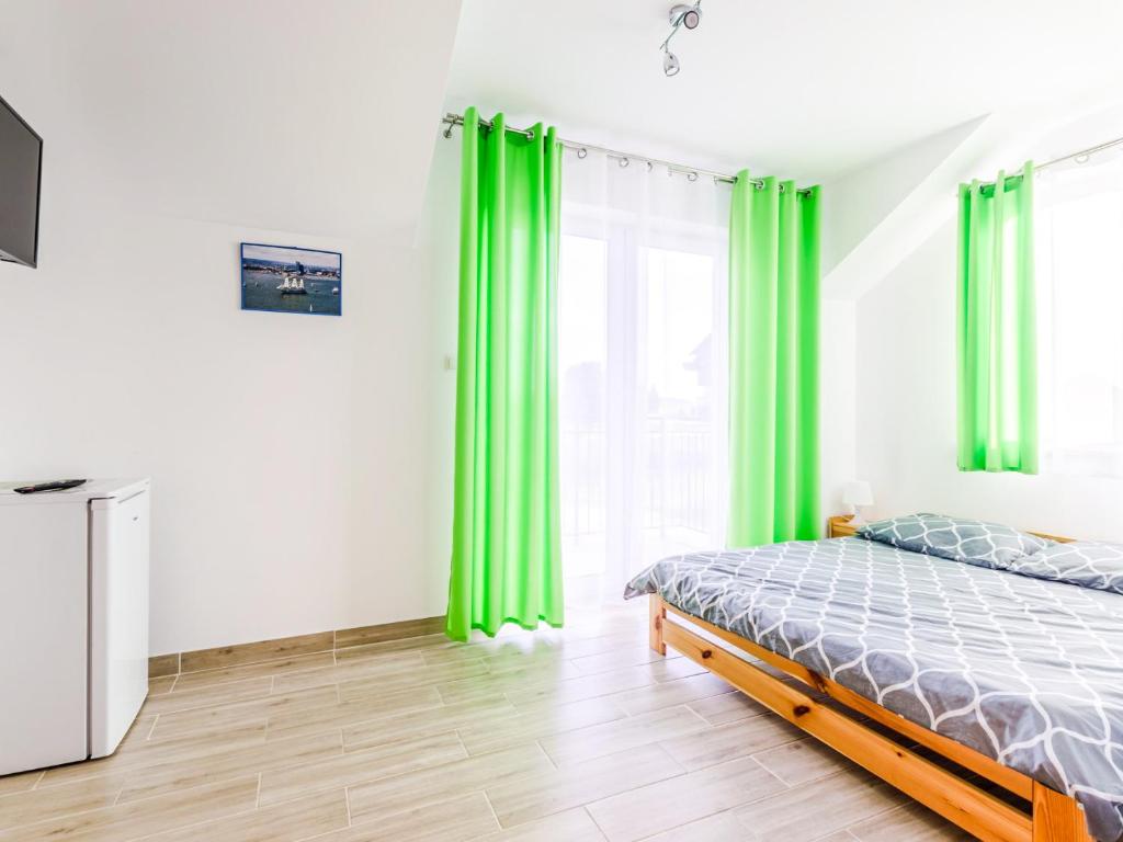 Postel nebo postele na pokoji v ubytování Willa Artus