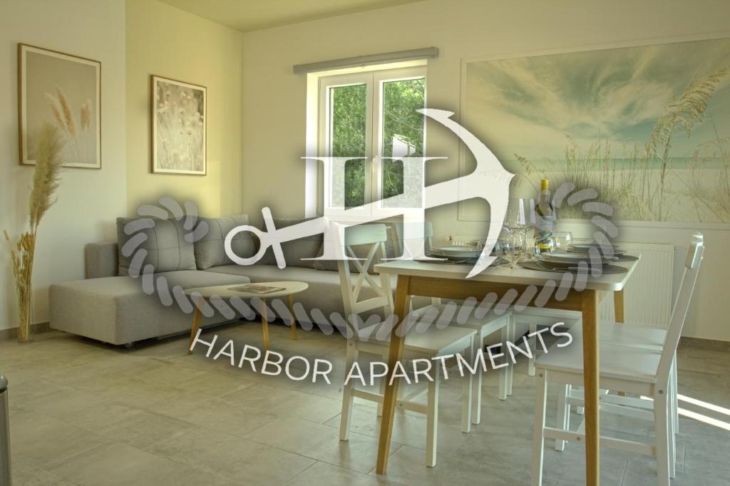 a living room with a table and a couch at Harbor apartments 2 in Opatija