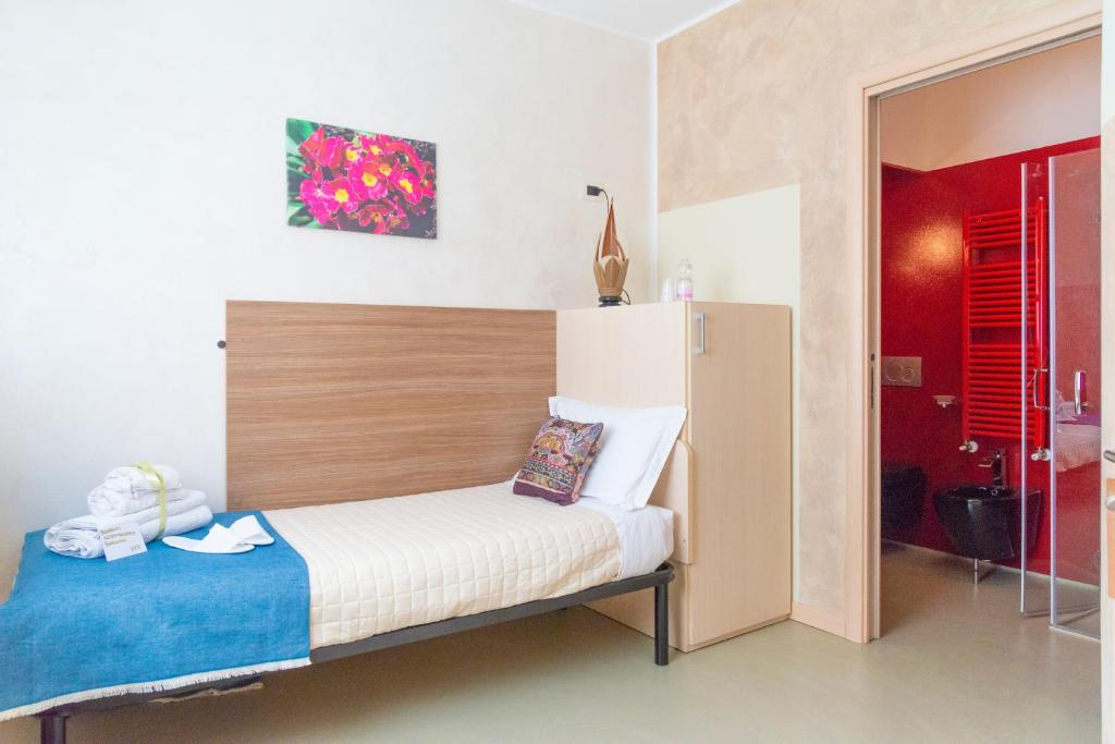 Łóżko lub łóżka w pokoju w obiekcie Affittacamere Bardolino