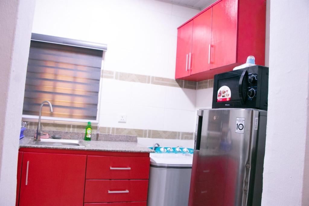 Kuchyň nebo kuchyňský kout v ubytování Easyinn Shortlet Apartment