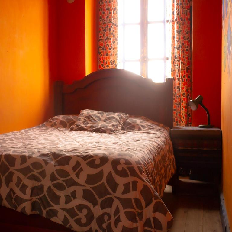 Postel nebo postele na pokoji v ubytování Hostal Café Tiana