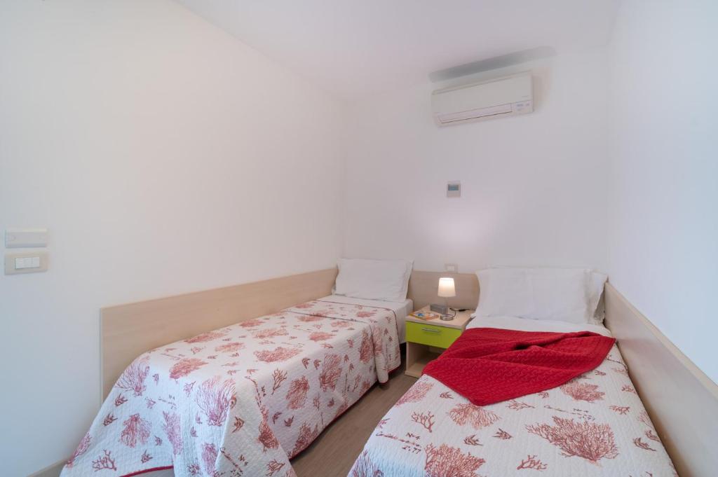 Postel nebo postele na pokoji v ubytování Residenza Monica