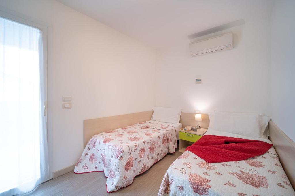 Postel nebo postele na pokoji v ubytování Residenza Monica