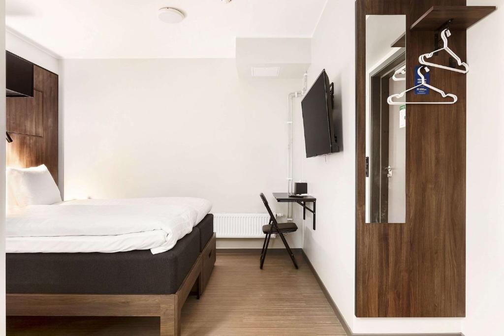 Postel nebo postele na pokoji v ubytování Sure Hotel Studio by Best Western Bromma
