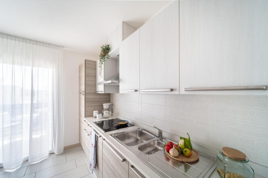 Kuchyň nebo kuchyňský kout v ubytování Residenza Monica