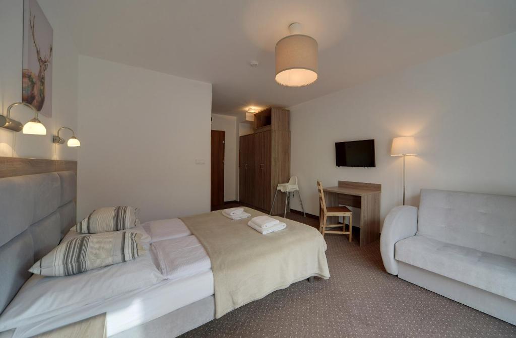 Televízia a/alebo spoločenská miestnosť v ubytovaní Beżowy i Nowoczesny Apartament Sun Seasons 24 w Szklarskiej Porębie by Noclegi Renters