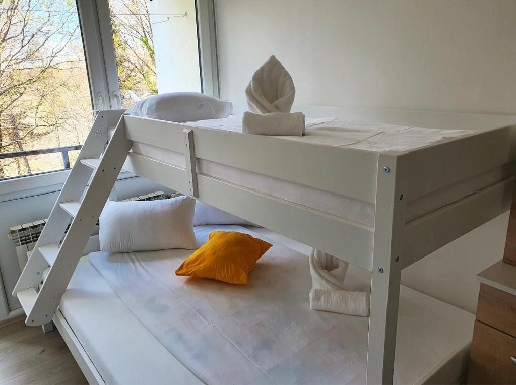 a white bunk bed in a room with a window at Center of Plitvice + Free Parking + Self Check-in in Plitvička Jezera