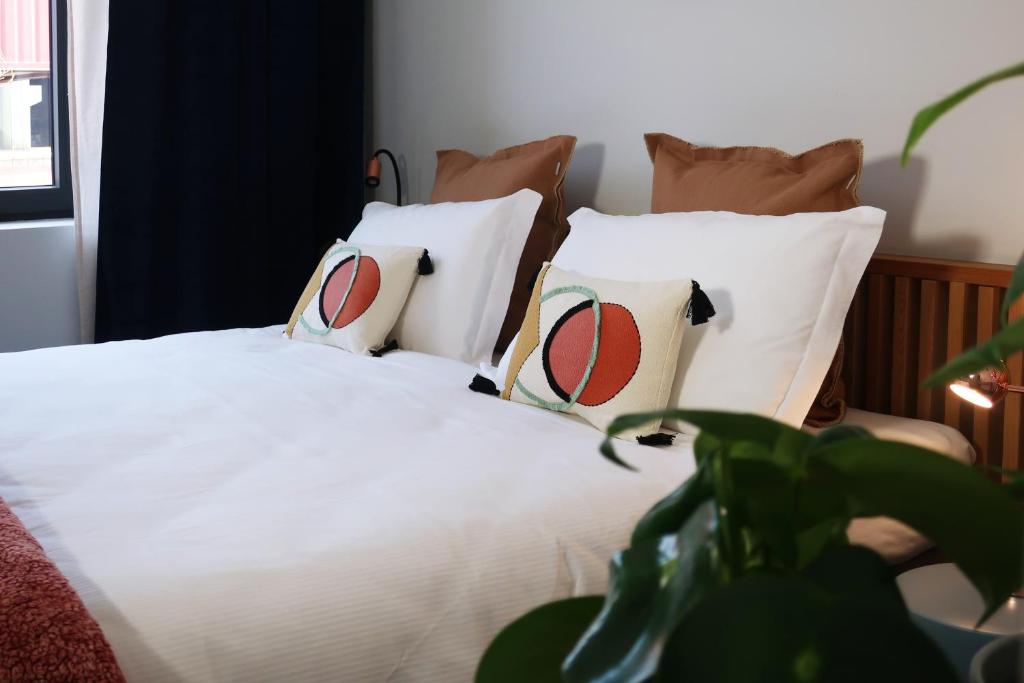 Een bed of bedden in een kamer bij Picobello Lago
