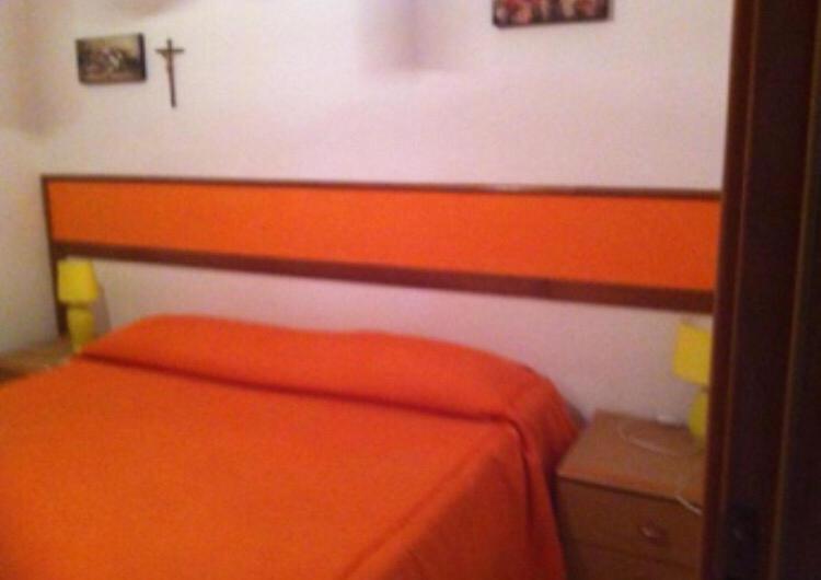Postel nebo postele na pokoji v ubytování Residence La Quiete