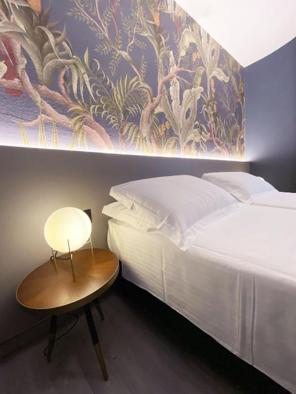 Postel nebo postele na pokoji v ubytování Hotel Astoria