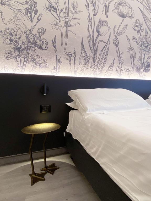 Postel nebo postele na pokoji v ubytování Hotel Astoria