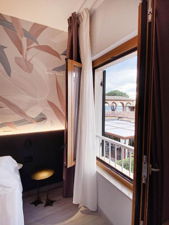 Postel nebo postele na pokoji v ubytování Hotel Astoria