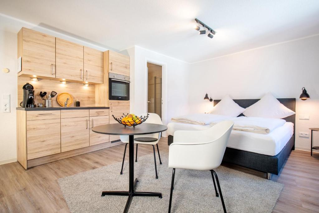 Postel nebo postele na pokoji v ubytování Hotel Busch