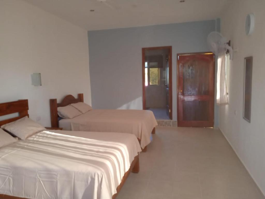 Postel nebo postele na pokoji v ubytování Ecohotel Shalom