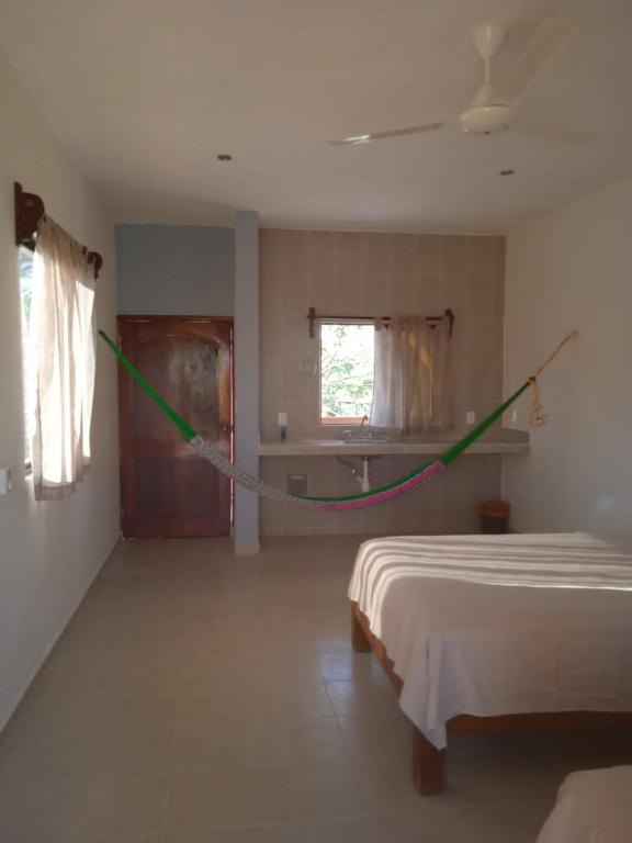Postel nebo postele na pokoji v ubytování Ecohotel Shalom