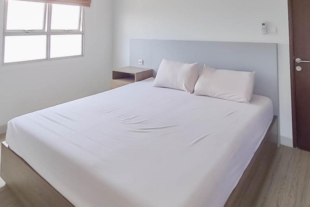 Katil atau katil-katil dalam bilik di RedLiving Apartemen Mekarwangi Square - Agus 2 Tower A