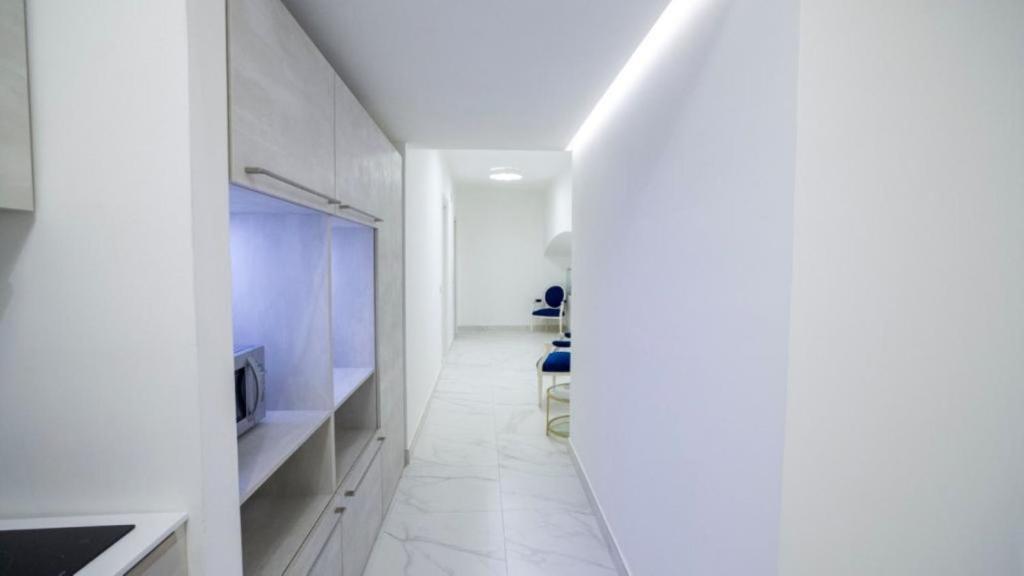 Televízia a/alebo spoločenská miestnosť v ubytovaní Albanèse Luxury Rooms