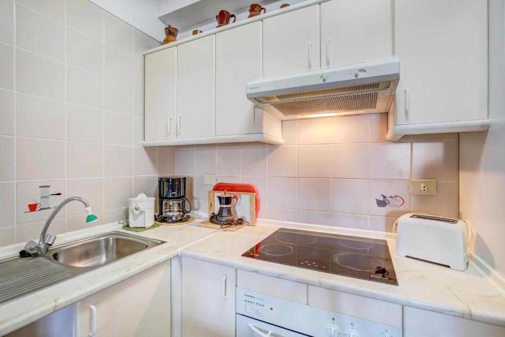 Kuchyň nebo kuchyňský kout v ubytování Apartamento Atlantic View
