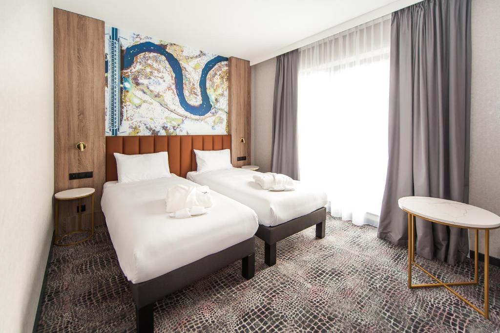 Postel nebo postele na pokoji v ubytování Mercure Bialystok