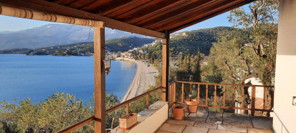 a balcony of a house with a view of the water at VILLA IMELDA in Afissos