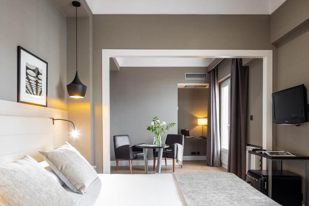 Postel nebo postele na pokoji v ubytování Hotel Cortezo