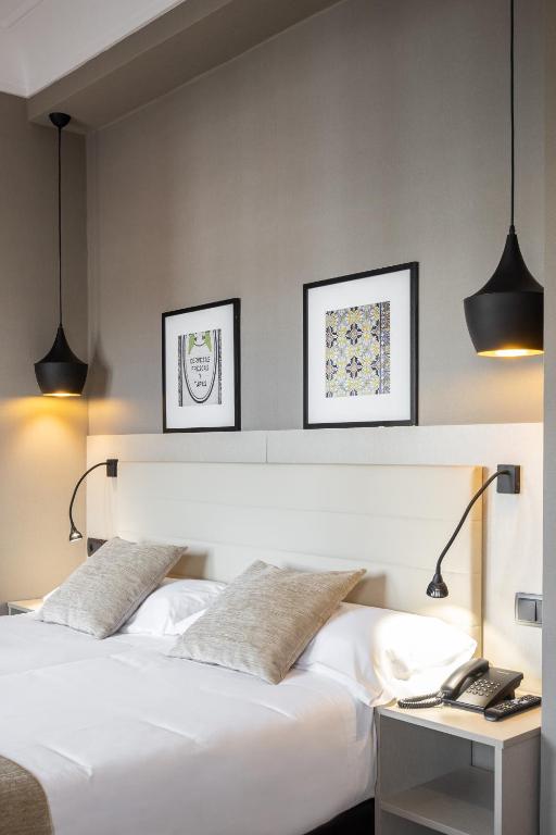 Postel nebo postele na pokoji v ubytování Hotel Cortezo