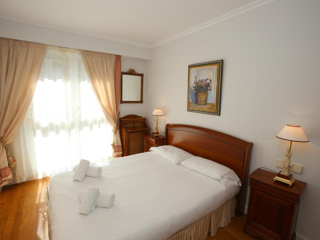 Posteľ alebo postele v izbe v ubytovaní Apartamento Ondarreta