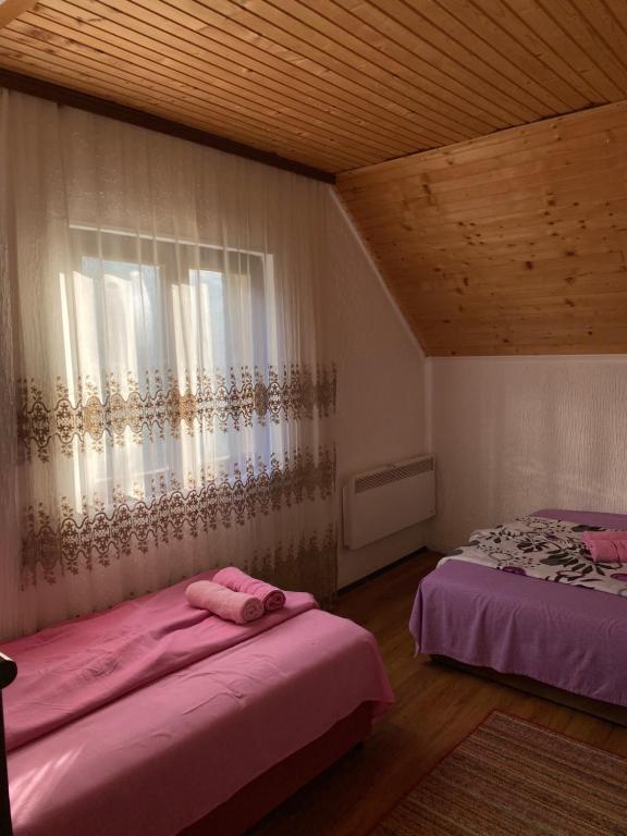 Postel nebo postele na pokoji v ubytování Vidikovac BIJELO POLJE