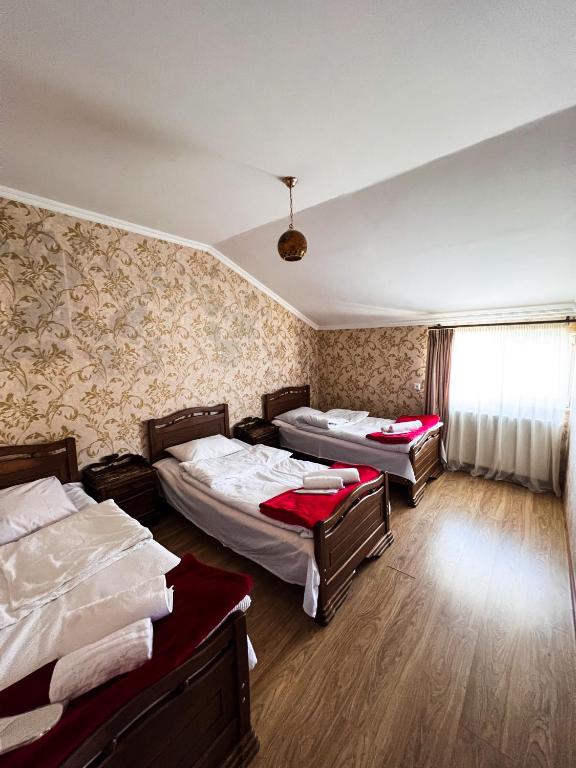 Postel nebo postele na pokoji v ubytování Giorgi's Guest House