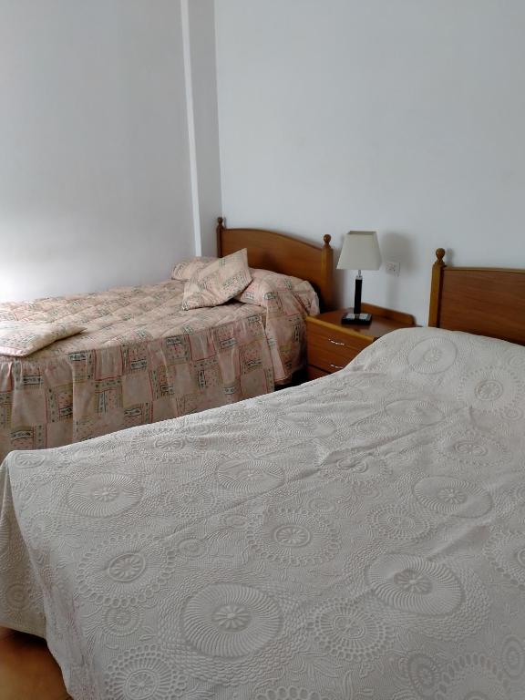 Postel nebo postele na pokoji v ubytování Casa da Fontiña